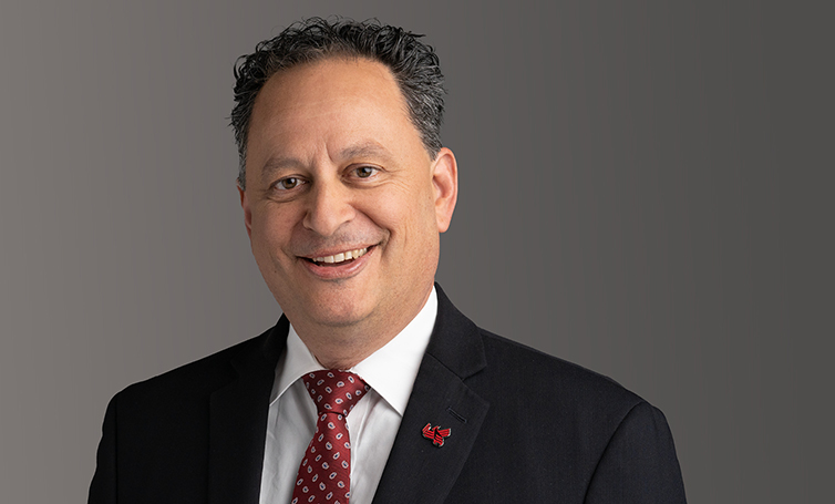 Open and play video message from University of Phoenix Provost John Woods in new tab