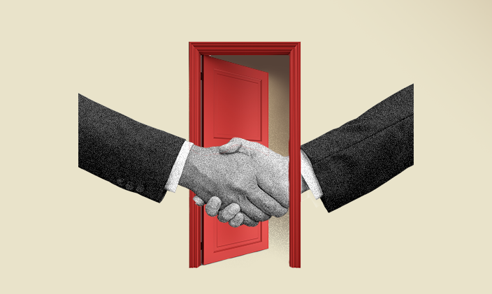 Two arms outstretched in a handshake with a red door open in the background.