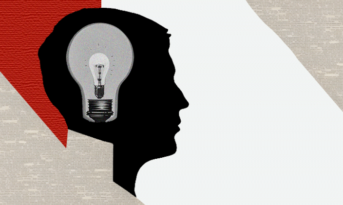 A silhouette of a head with a lightbulb depicted inside it.