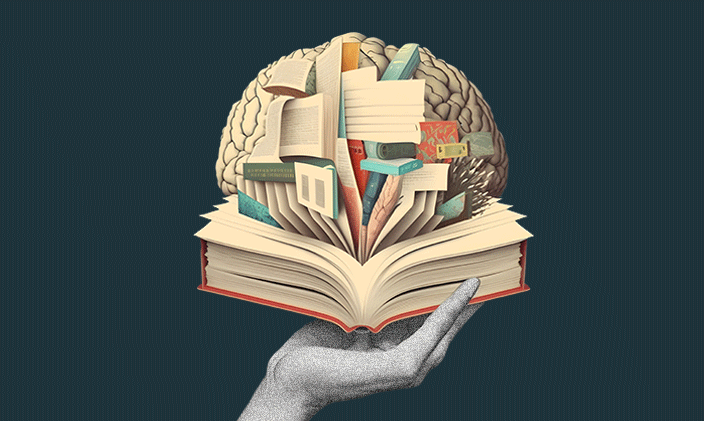 An open book held by a single hand representing K-12 Trauma Informed Education.