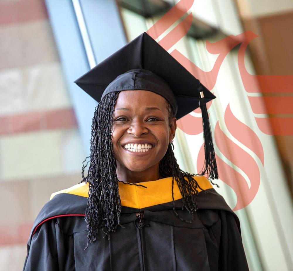 A smiling woman in graduation attire, encouraging prospective MBA students to take the next step.