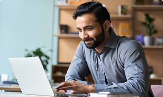Business man working on a laptop at home